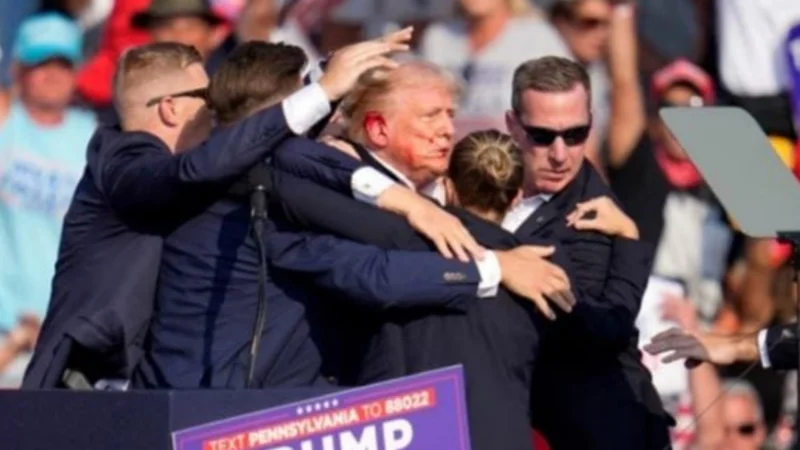 Donald Trump injured in election rally shooting, assailant killed