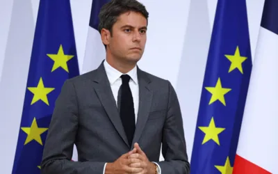 French PM looks to rebuild political support after party backing