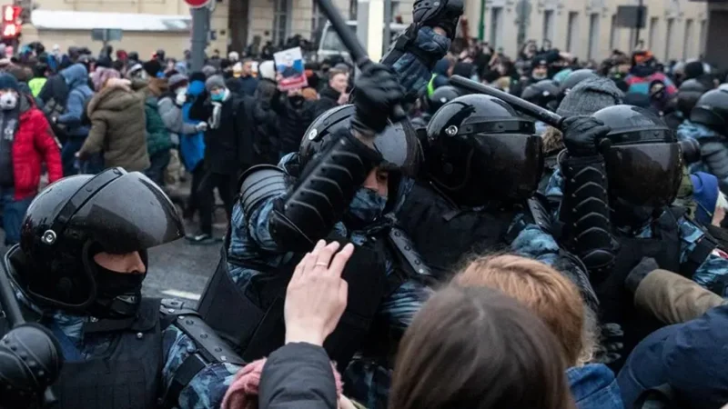 Russian people protest against riot police as activist got arrested