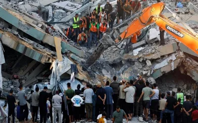 War-damaged Gaza building collapses, killing 12, dozens feared trapped