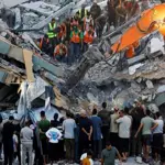 War-damaged Gaza building collapses, killing 12, dozens feared trapped