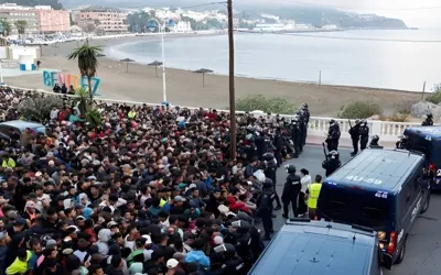 Spain launches Ceuta beach sweep as police confront migrants