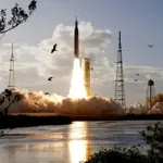 Russia delays lunar missions as US marks historic flight