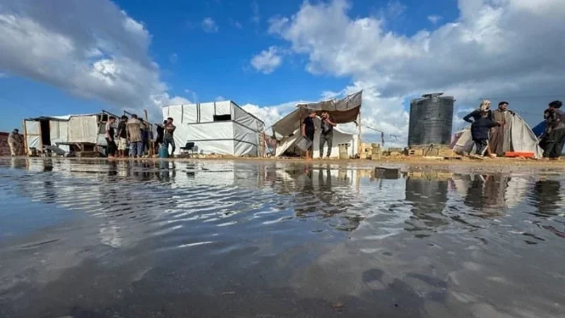 Deadly strikes in Gaza coincide with heavy flooding across strip