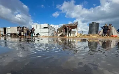 Deadly strikes in Gaza coincide with heavy flooding across strip